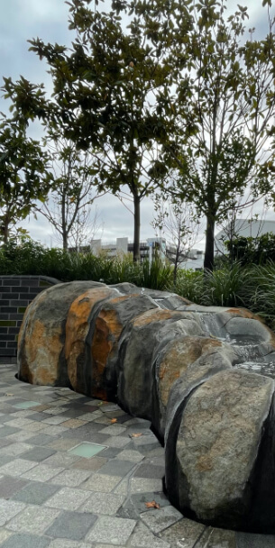 Boulder with water feature