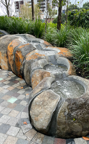 Boulder with water feature